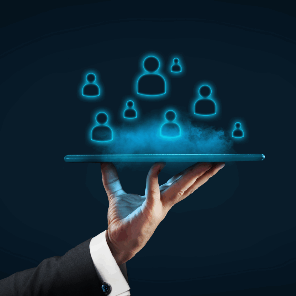 Man holding a tablet with user icons emerging, symbolizing custom-built strategies and tailored risk solutions at Professional Risk & Asset Management